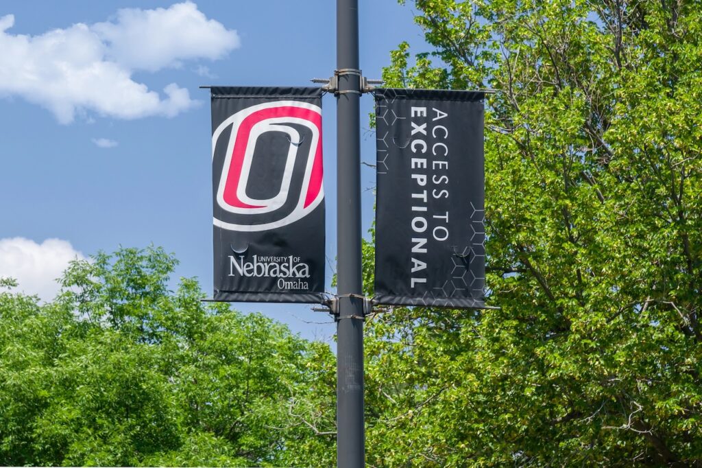 OMAHA, NE, USA - College flag on the campus of the University of Nebraska Omaha.