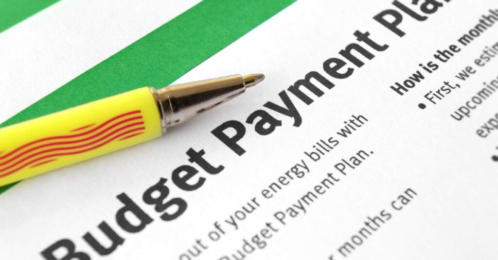 A pen sits on a piece of papeer that reads, "Budget Payment Plan"