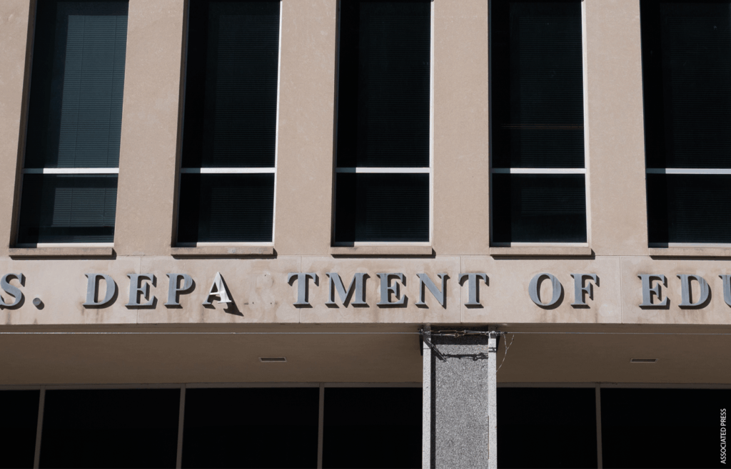 Close up photo of exterior of U.S. Department of Education building in D.C. with letters missing